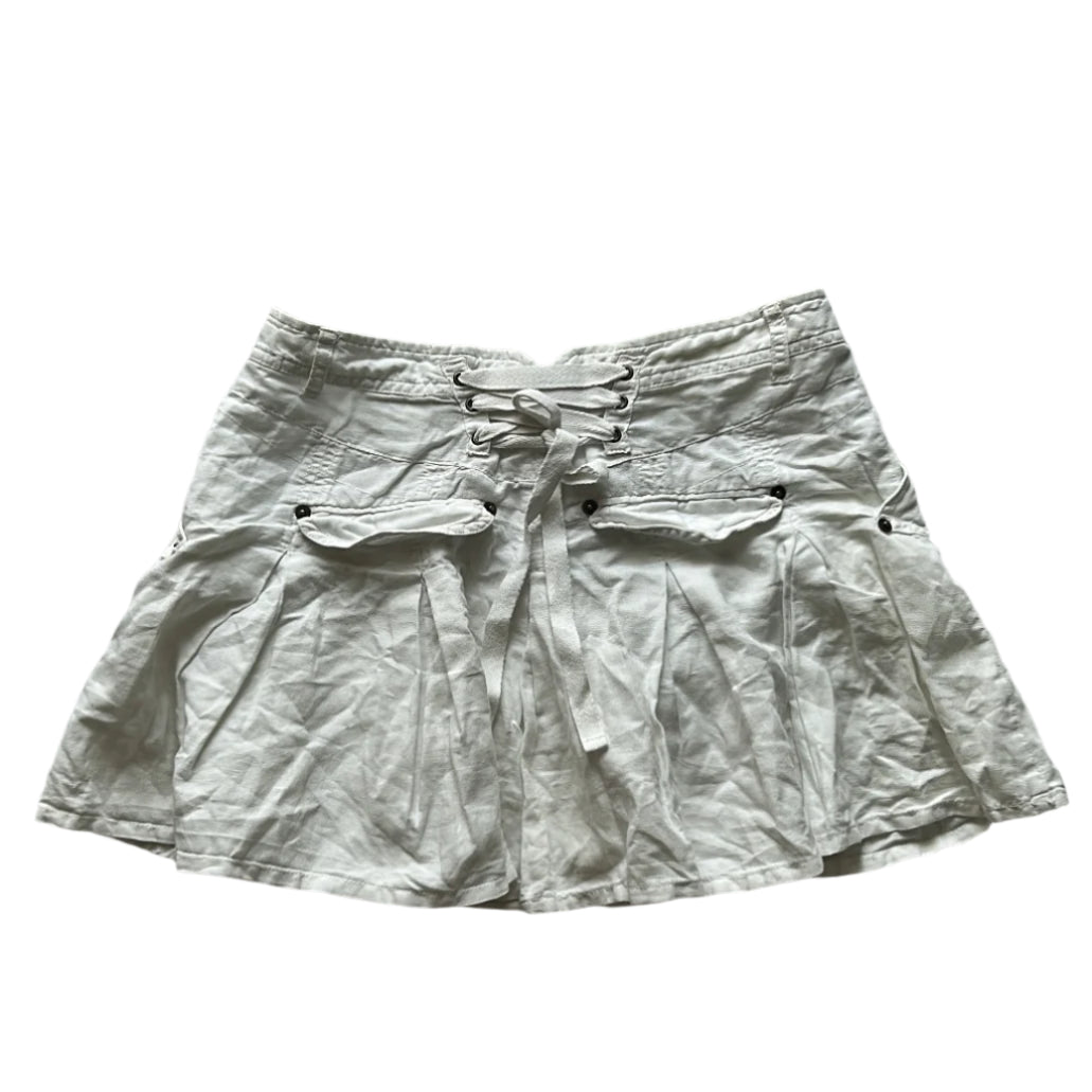 white pleated mini skirt with corset like adjustable detail on the back